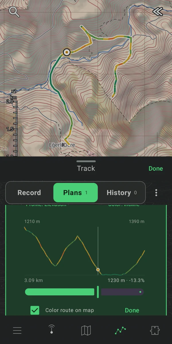 A route colored by incline on the map, with its elevation profile in a resizable Track panel